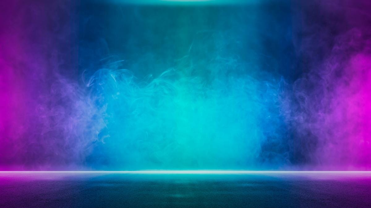 A colorful, futuristic scene with swirling blue, pink, and purple smoke against a dark background, illuminated by neon lights from above and at the base, creating a glowing, vibrant atmosphere.